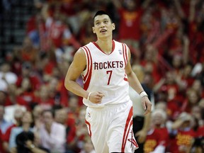 Houston Rockets guard Jeremy Lin (7) celebrates after making a three-pointer during the fourth quarter against the Portland Trail Blazers. Mandatory Credit: Andrew Richardson-USA TODAY Sports