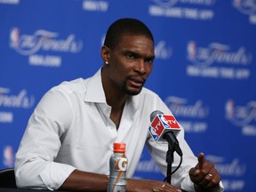 Miami Heat forward Chris Bosh answers questions during a press conference after the game against the San Antonio Spurs in game two of the 2014 NBA Finals at AT&T Center. Mandatory Credit: Soobum Im-USA TODAY Sports