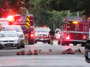 Officials blocked off Davis near Mitton Street on Friday night while responding to a garage fire. BRENT BOLES / THE OBSERVER / QMI AGENCY