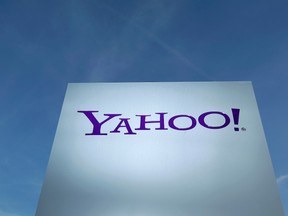 A Yahoo logo is pictured in front of a building in Rolle, 30 km (19 miles) east of Geneva, in this file picture taken December 12, 2012. (REUTERS/Denis Balibouse)