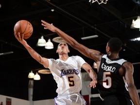 Lakers Jordan Clarkson goes up for a shot over Raptors' Bruno Caboclo during Summer League play in Las Vegas Friday night. Caboclo had 12 points in the Raptors' 88-78 win over the Lakers. (AFP)