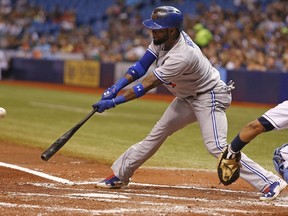 Jose Reyes of the Toronto Blue Jays hits a single to left field during the third inning of a game against the Tampa Bay Rays on July 11, 2014 at Tropicana Field. (Brian Blanco/Getty Images/AFP)