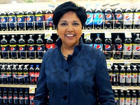 PepsiCo CEO Indra Nooyi poses for a portrait by products at the Tops SuperMarket in Batavia, New York, June 3, 2013. REUTERS/Don Heupel