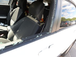 Police in Montreal broke a window of a vehicle where a baby was left alone, Thursday, July 10, 2014.
MAXIME DELAND / QMI AGENCY