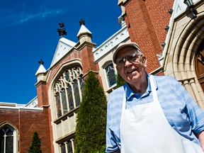 George Ford poses in front of Robertson Wesley United Church in Edmonton. Ford is a long-time volunteer who has won a Governor- General's Caring Citizen award. He helps organize a monthly community dinner at the church. (CODIE MCLACHLAN/Edmonton Sun)