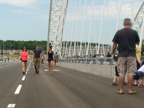 The long-awaited Strandherd-Armstrong bridge finally opened to traffic on Saturday, July 12, 2014. Hundreds of people came out to celebrate its opening.
Danielle Bell/Ottawa Sun/QMI AGENCY