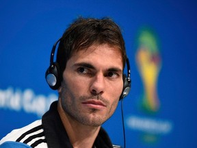 Argentina's Jose Basanta listens to a question during a news conference at the Maracana stadium in Rio de Janeiro July 12, 2014, ahead of their 2014 World Cup Final soccer match against Germany on Sunday. (REUTERS/Dylan Martinez)