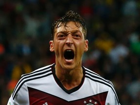 Germany's Mesut Ozil celebrates scoring during extra time in their 2014 World Cup game against Algeria at the Beira Rio stadium in Porto Alegre June 30, 2014. (REUTERS/Darren Staples)