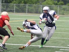 In this file photo,  Sudbury Spartans running back Scott Smith (24) rushes the ball against the Sarnia Imperials during NFC action at James Jerome Sports Complex.