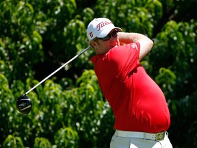 Brad Fritsch of Canada tees off on the second hole during the final round of the John Deere Classic held at TPC Deere Run on July 13, 2014 in Silvis, Illinois.  Gregory Shamus/Getty Images/AFP