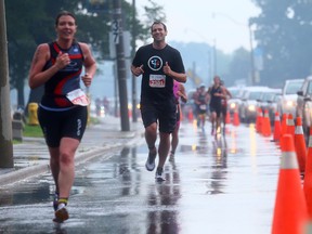 A participant runs along Lake Shore Blvd. W. in an event which forced the closure of a lane on Sunday. (DAVE ABEL, Toronto Sun)