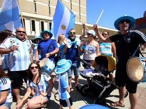 Local Argentinean soccer fans, including Waldemar Dutra, 31, on the drums, gather at Centennial Plaza in downtown Edmonton, AB for the final game of the 2014 World Cup on July 13, 2014. Trevor Robb/Edmonton Sun/QMI Agency