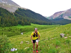 Calgary marathoner Adam Campbell running in the Hardrock 100, where he finished in third place despite being caught in lightning strike. Photo courtesy Byron Powell/iRunFar.com