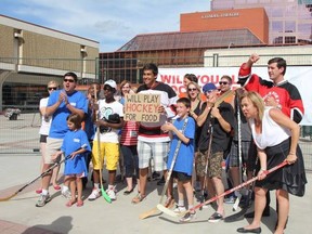 Don Iveson and former city councillor Linda Sloan, right, are seen at last year’s Five Hole for Food. This year’s street hockey event, which raises money for the Edmonton Food Bank, is happening Wednesday at Centennial Plaza, from 3 p.m. to 9 p.m. (SUPPLIED)