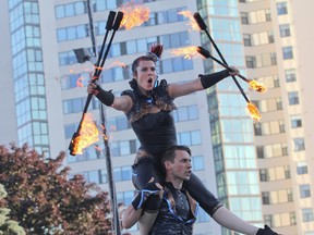 Member sof Flame Oz perform during the 2014 Kingston Buskers grand finale show in Confederation Park on Sunday. The group won the People's Choice award. (Julia McKay/The  Whig-Standard)