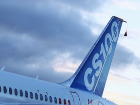 The Bombardier CSeries aircraft sits on the tarmac prior to its first test flight in Mirabel, Quebec, in this Sept. 16, 2013 file photo. REUTERS/Christinne Muschi/Files