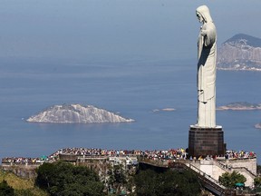 Tourists visit the Christ the Redeemer statue, in Rio de Janeiro June 27, 2014. (REUTERS/Ricardo Moraes)