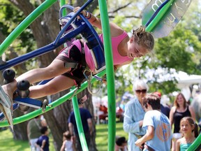Belleville-born Ari Larratt, 11, of Anchorage, Alaska rides the GyroGym gyroscope at the Belleville Waterfront and Ethnic Festival Saturday, Jul 7, 2014 in Belleville, Ont. It was one of many free attractions in the children's village. Luke Hendry/Belleville Intelligencer/QMI Agency