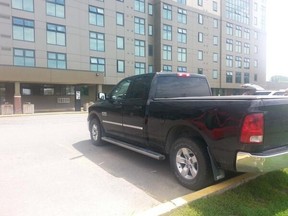 Residents along Lees Ave. say a car believed to be fleeing after gunshots were fired at about 1 a.m., slammed into this pickup truck outside an apartment complex. No one was reported hit in the incident. (DANIELLE BELL Ottawa Sun)