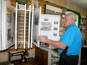 National Communities in Bloom judge Gerry Teahen looks at some of the artifacts at the Draytom Valley and District Historical Society Museum last week during the Communities in Bloom tour of Drayton Valley on July 9.