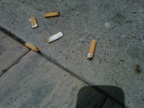 Cigarette butts litter Montreal Rd. on Monday, July 14, 2014. The Quartier Vanier BIA is announcing a partnership with CigBins, a new local collection and recycling program, later this week. 
KELLY ROCHE/OTTAWA SUN