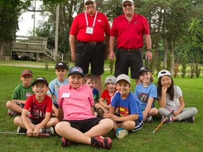 Joe Barnes and Brian Miller are the co-founders of TGA Canada. They were photographed as their students were playing at the chip and putt at Forest Glen Golf Centre on Oxford Street in London. (MIKE HENSEN, The London Free Press)