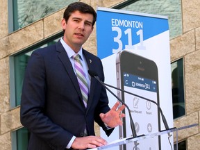 Edmonton mayor Don Iveson discusses the City of Edmonton's new 311 cell phone app to members of the media outside of City Hall in Edmonton, AB on July 14, 2014. TREVOR ROBB/POSTMEDIA NETWORK