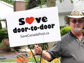 Tony Baldassarra, the president of Kingston Local 556 of the Canadian Union of Postal Workers, has had his union's lawn signs supporting home delivery ordered taken down. IAN MACALPINE/THE WHIG-STANDARD