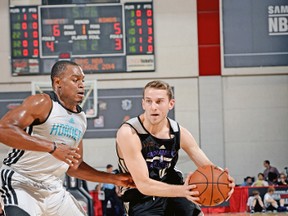 Sacramento’s Nik Stauskas drives against a Charlotte Hornets defender during Summer League action. (AFP)