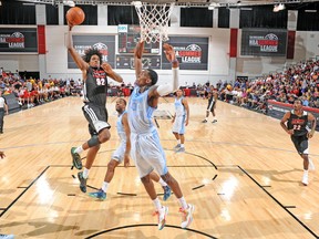 Raptors big man Lucas Nogueira goes up for a dunk against the Denver Nuggets during Summer League. Nogueira tried to comfort rookie Bruno Caboclo after being dunked on. (AFP)