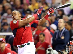 American League outfielder Yoenis Cespedes of the Oakland Athletics takes a swing during the Home Run Derby at Target Field in Minneapolis, July 14, 2014. (JESSE JOHNSON/USA Today)