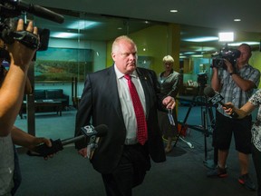 Toronto Mayor Rob Ford leaves his office at City Hall without answering reporters questions Tuesday July 15, 2014. (Ernest Doroszuk/Toronto Sun)