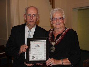 Noble Grand Don Pierce, left, is presented with a Grand Lodge Certificate in recognition of the 140th anniversary of Model Lodge No. 147 I.O.O.F. Making the presentation is Grand Master of the Grand Lodge of Ontario Sandra McWhirter.