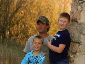 Aaron Mooney, centre, drowned last Friday rescuing his son from a submerged truck. (Fotheringham-Mcdougall Funeral Service)