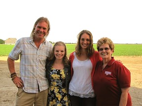 Mark Lumley (left) and Jeanne Fox (far right) presented Grace Mullen and Paige Handsor with the first Brian Fox Memorial Agriculture Scholarships. The scholarships were started last year by the Ontario Sugarbeet Growers' Association to honour the late Brian Fox. The farmer near Wallaceburg was a driving force in the effort to bring the sugar beet industry back to Ontario. The scholarships were awarded at a fundraising barbecue on July 5.