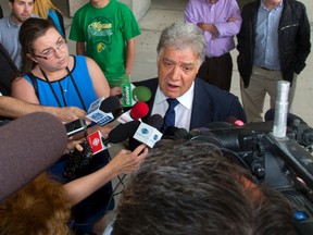 Former London Mayor Joe Fontana talks to the media outside the London courthouse after being given a sentence of four months house arrest and 18 months probation in his fraud conviction in London, Ont. on Tuesday July 15, 2014. (MIKE HENSEN, The London Free Press)
