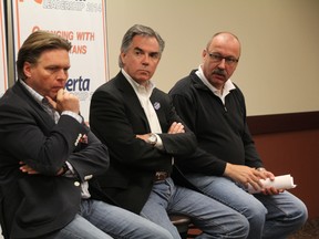 PC Alberta leadership candidates Thomas Lukaszuk, from left, Jim Prentice and Ric McIver take questions from the audience during the public forum held at the ENTREC Centre in Evergreen Park in the County of Grande Prairie Alberta on Saturday, June 21, 2014. Each candidate had the chance to lay out their campaign platforms and take questions from the audience. JOCELYN TURNER/DAILY HERALD-TRIBUNE