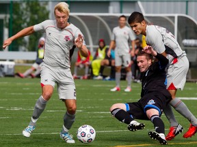 Head coach Colin Miller says Alberto Navarro, right, shown here in action against the Eddies last season, will add to the competition in the team's backfield. (Edmonton Sun file)