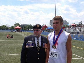 Noah Rolph, right, poses with medals he won at the Legion Provincial Track and Field Championships in Brampton July 11 and 12. (Contributed photo)