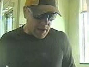 Tuesday, July 15, 2014 Ottawa -- Police are asking the public to help them ID this suspect, believed to be responsible for a robbery at an ATM at a South Keys bank.Submitted photoOTTAWA SUN/QMI AGENCY