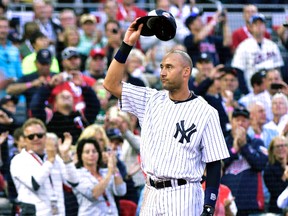 American League shortstop Derek Jeter of the New York Yankees waves to the crowd as he is replaced in the fourth inning during the MLB All Star Game at Target Field in Minneapolis, July 15, 2014. (SCOTT ROVAK/USA Today)