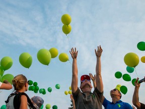 Green balloons are released at Parkhill Community Hall in Calgary, Alta., on Tuesday, July 15, 2014.
Green balloons were released at 8 p.m. throughout Calgary and area to show support for the families of five-year-old Nathan O'Brien and his grandparents Alvin and Kathy Liknes, all of whom police believed were murdered despite no bodies being found.
Lyle Aspinall/Calgary Sun/QMI Agency