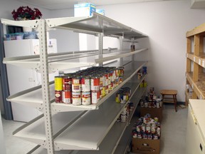 A shelf in the Salvation Army’s Kenora food bank stands mostly empty. What is on the shelves is reserved for August’s food hampers.