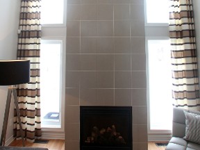 Look way up! Keep on looking. The tiled fireplace surround  in the Franklin model stretches all the way up to the ceiling.