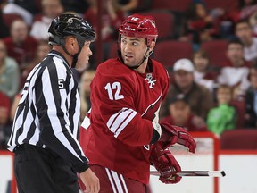 Paul Bissonnette of the Phoenix Coyotes looks back to the penalty box as he skates off the ice for a game misconduct during the first period of the preseason NHL game against the Los Angeles Kings at Jobing.com Arena on September 15, 2013. (Christian Petersen/Getty Images/AFP)