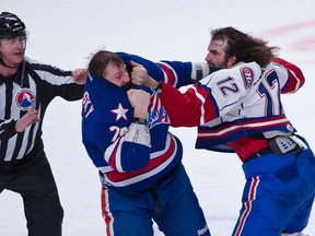 Sudbury native Zack Stortini, with the Hamilton Bulldogs two seasons ago, mixes it up with a Rochester Americans player. Stortini signed with the Philadelphia Flyers late last week.