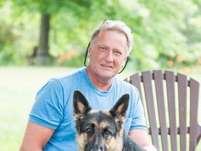 Owner Jeff Inglis with Kaylee a German shepherd that helped catch a burglar at their home in St. Catharines, Ont. on July 16, 2014. (Bob Tymczyszyn/QMI Agency)