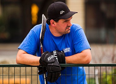 Tracey Risser watches the action from the sidelines during the Five Hole for Food ball hockey tournament at Centennial Plaza in Edmonton, Alta., on Wednesday, July 16, 2014. The aim of the tournament is to gather donations for local food banks. Edmonton is the 11th stop out of 13 on this year's tour. Codie McLachlan/Edmonton Sun/QMI Agency