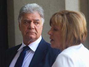 Former London Mayor Joe Fontana takes a break outside the court house with his wife Vicky during his sentencing for his fraud conviction in London, Ont. on Tuesday July 15, 2014. (MIKE HENSEN, The London Free Press)