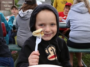 JOHN LAPPA/THE SUDBURY STAR/QMI AGENCY
Wyatt Raaska, 4, enjoys blueberry pancakes at a pancake breakfast at the Flour Mill Museum in Sudbury, ON. on Wednesday, July 16, 2014. The event is part of the Greater Sudbury Blueberry Festival which wraps up on July 20.